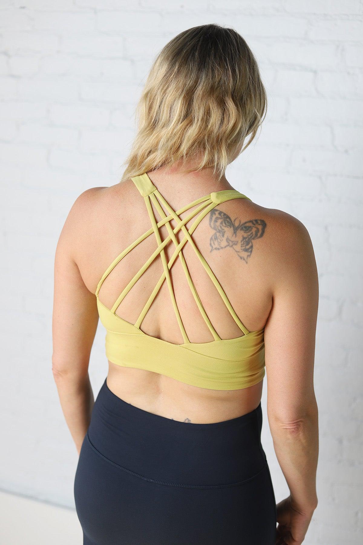 http://gallery512boutique.com/cdn/shop/files/Lizzy-Strappy-Back-Sports-Bra-Yellow-Pear-Final-Sale.jpg?v=1708613999